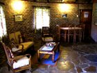 The open plan lounge and dining area in Lothlorien Cottage in Hogsback, South Africa